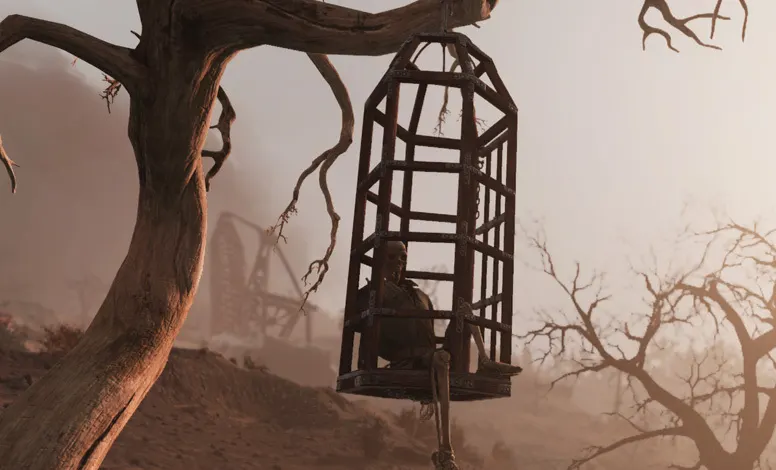 Jaula colgada de un árbol con un cadáver adentro.